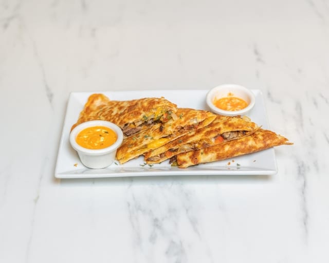 PORK GRIOT QUESADILLA.